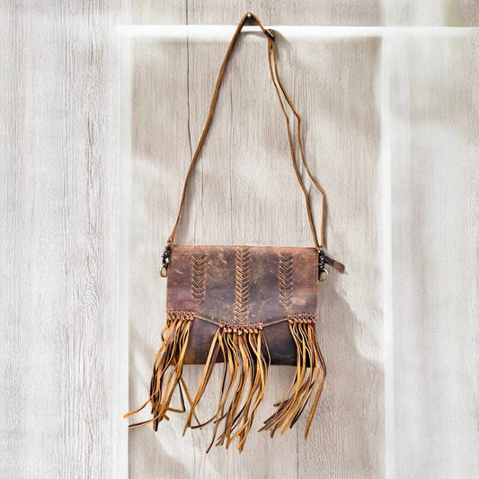 Rustic leather fringe crossbody bag