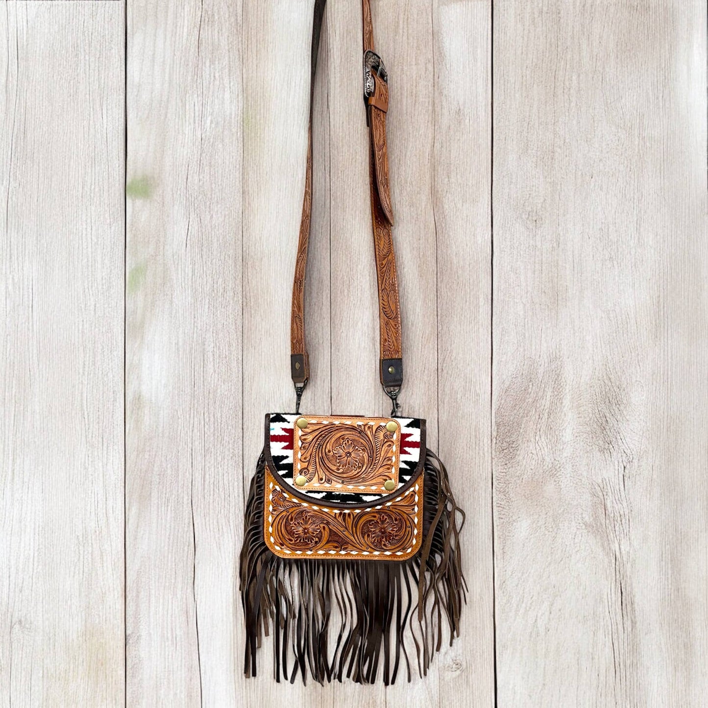 Aztec tooled leather fringe crossbody bag