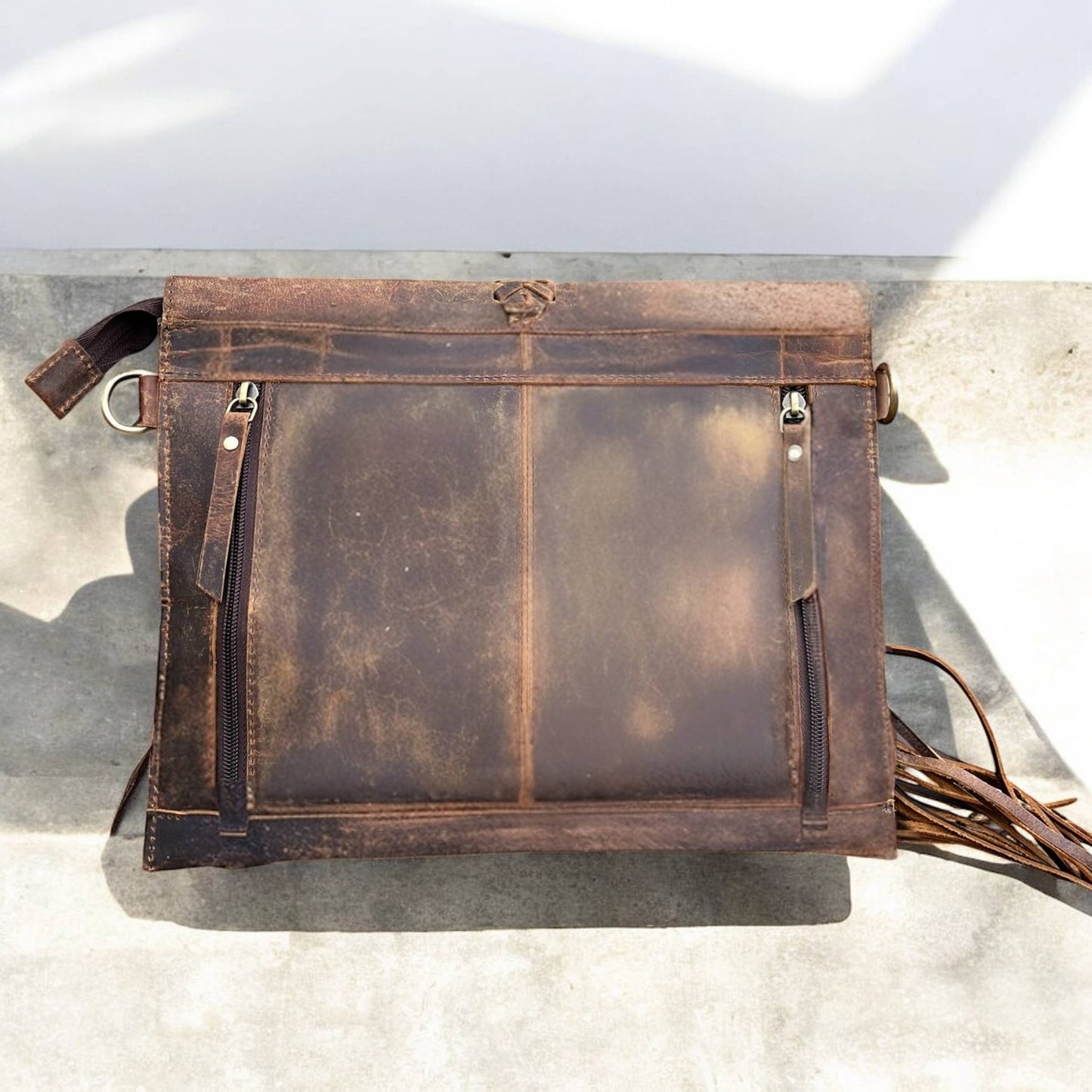Rustic leather fringe crossbody bag 